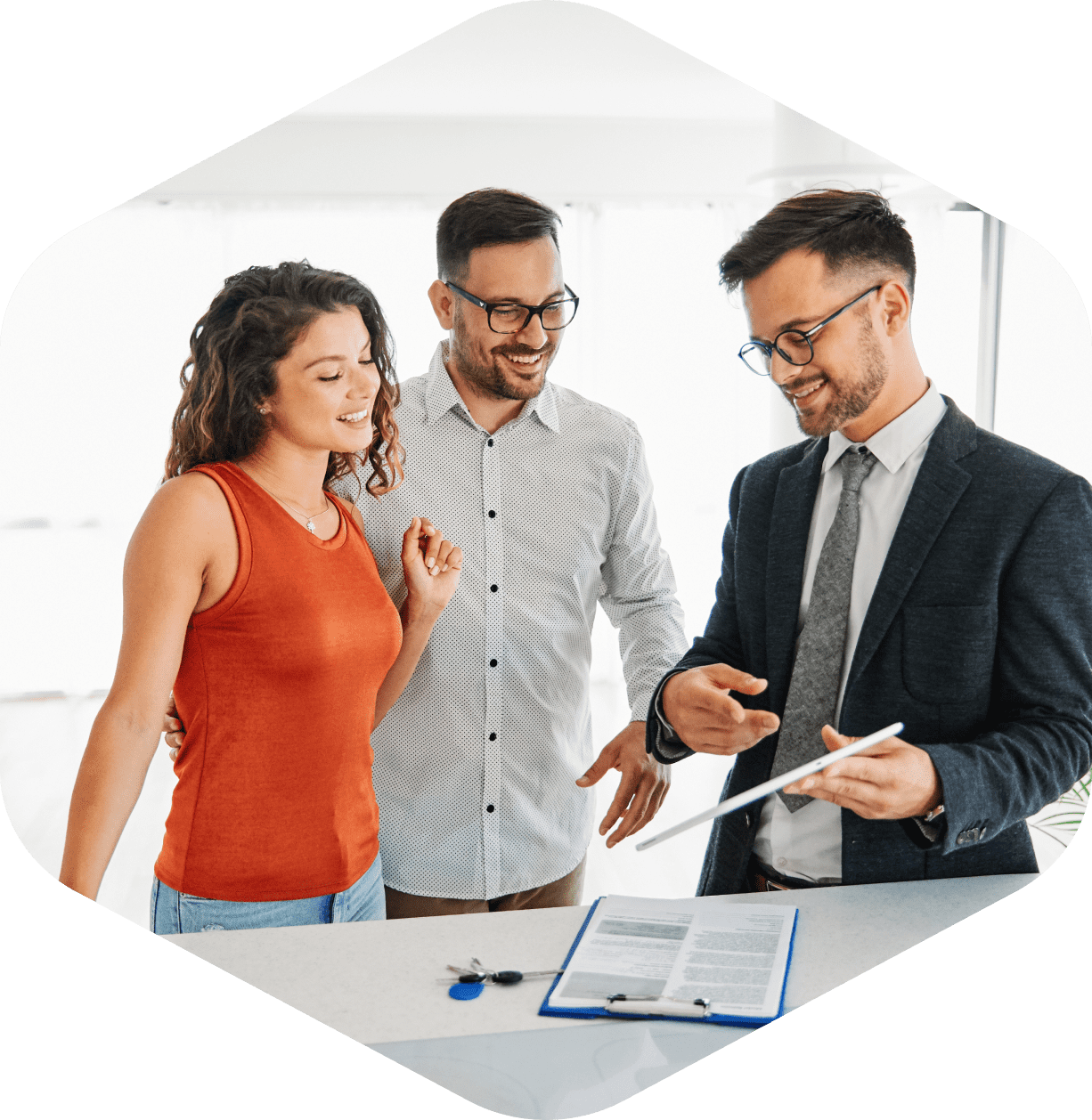 Couple discussing paperwork with a professional.