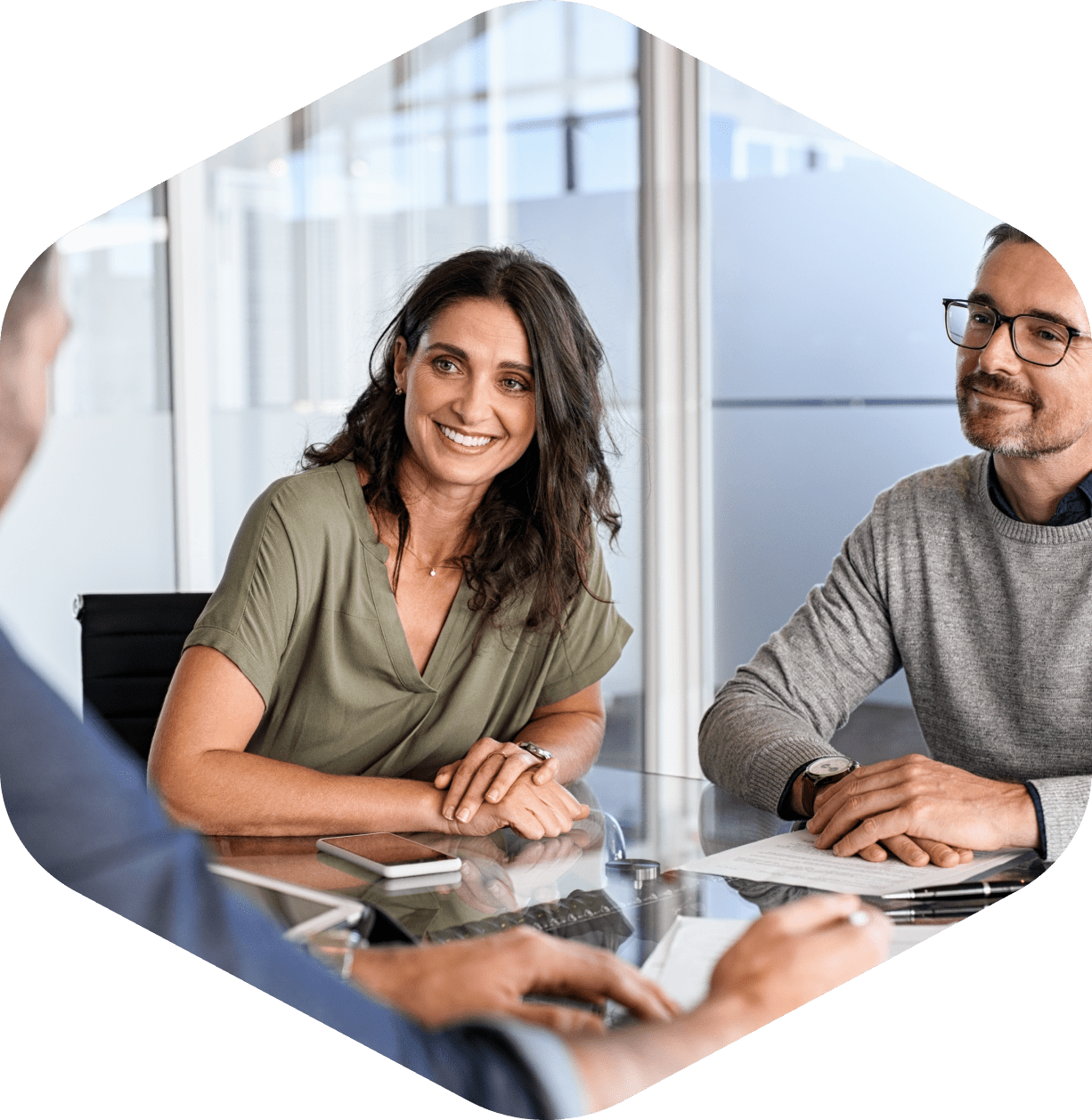 Smiling colleagues having a meeting in office.