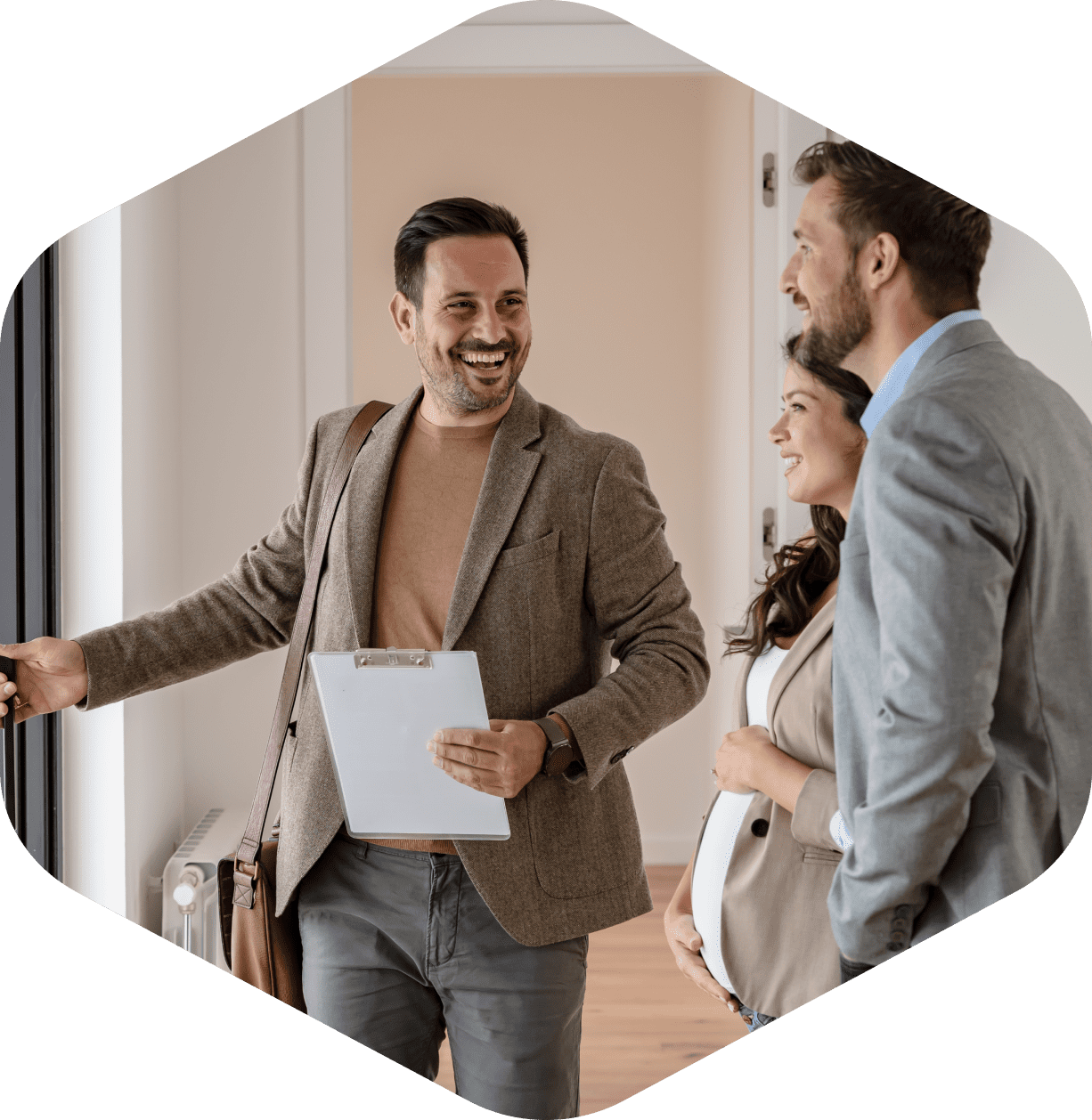 Real estate agent showing couple a house.